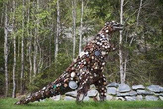 Dinosaur sculpture made from old clocks