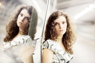 Woman and her mirror image
