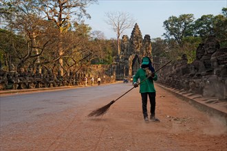 Street sweeper in front of the southern gate of Angkor Thom