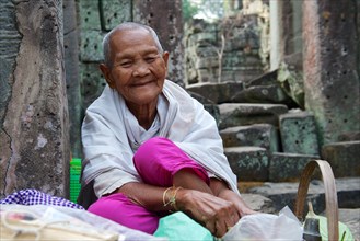 Old female Shaman at the temple complex of Preah Khan or Prah Khan