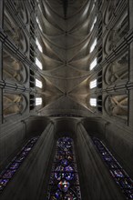 Vaulted ceiling and stained-glass windows