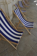 Sun chairs in front of a cafe