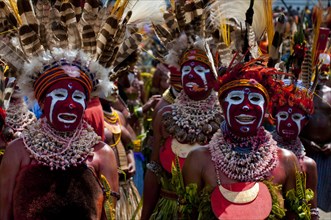 Colourfully decorated and painted tribesmen celebrating the traditional Sing Sing in the highlands