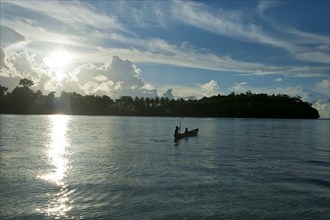 Boys in a canoe in the Marovo Lagoon