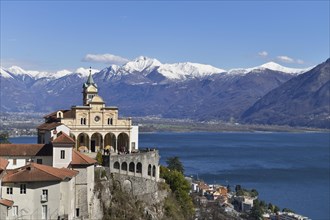 Sanctuary of the Madonna del Sasso or Our Lady of the Rock looking over Lake Maggiore towards snow-capped mountains