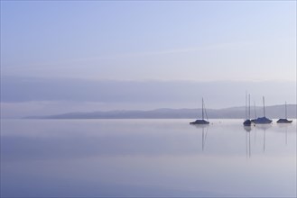 Lake Starnberg with sailing boats in the morning