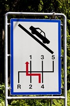 Sign for motorists to switch back a gear