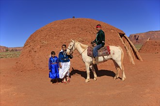 Navajo Indian family with a horse