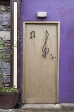 Front door with a clef