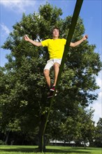 Athlete balancing on a slackline