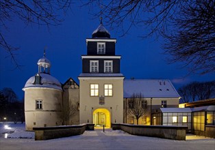 Illuminated Schloss Martfeld Castle at dusk