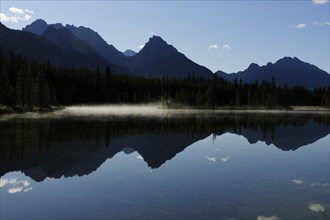 Foothills of the Rocky Mountains reflected in a lake