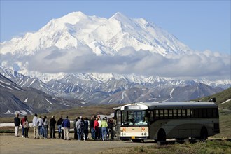 The Wilderness Tour Bus of the Denali National Park and Preserve is stopping at the Stony Hill observation point with views of Mt McKinley