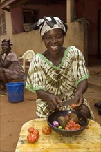 Woman preparing a traditional tomato dish