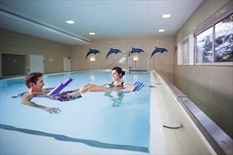 Patient and physiotherapist during underwater therapy