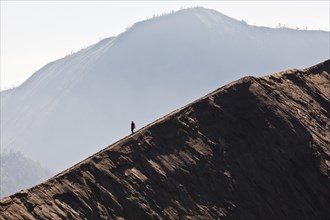 Hiker on Mount Bromo volcano