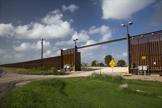 A nearly-completed section of the border fence that separates the United States from Mexico