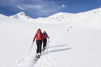 Ski tourers during the ascent of Mt Stolz in Lagauntal valley near Maso Corto in Val Senales
