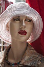Head of a fashion doll with hat