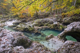 Bizarre rock formations at the mountain stream Mostnica in autumn