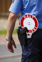 Police officer with sign