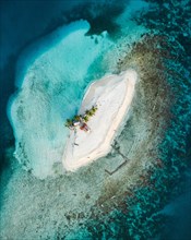 Tropical lonely little island from above