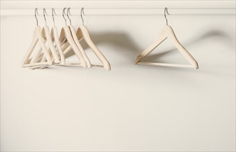 Empty hangers on a clothes rack