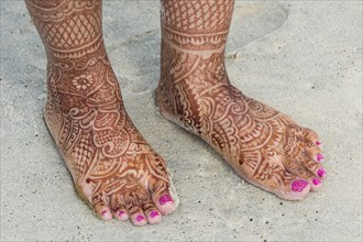 Feet of a bridge painted with henna