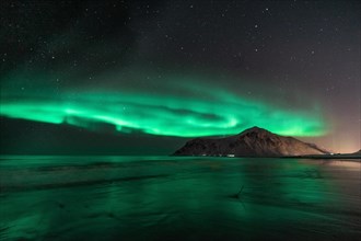 Northern Lights (Aurora Borealis) with starry sky at the beach