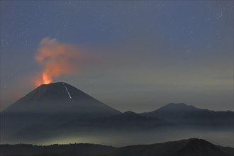 Active Gunung Bromo volcano at night