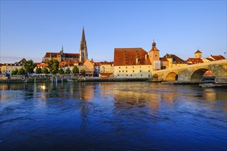 Stone bridge over Danube and old town with cathedral
