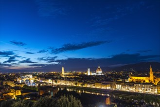 Illuminated city panorama at dusk with Florence Cathedral