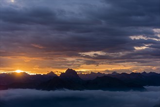 Allgau mountains with sea of fog at sunrise