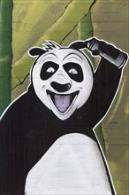 Laughing panda with spray can in hand