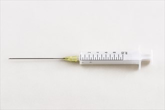 A syringe with a hypodermic needle