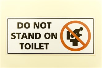 Prohibition sign 'do not stand on toilet'