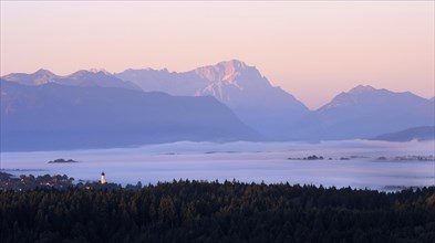 View from Peretshofener Hohe of Konigsdorf and the pre Alps to Zugspitze at sunrise
