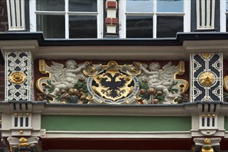 Double-headed eagle on the wooden balcony of the historic Town Hall