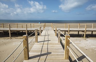 Wooden footbridges at the beach of Riumar