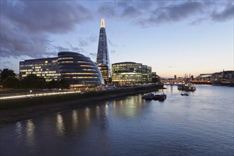 Promenade on the River Thames with City Hall and Shard high-rise building