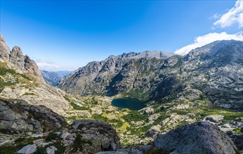View on the mountain lake Lac de Capitello with surroundings