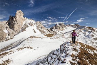 Mountaineer during the ascent of Mt Tullen via the Gunther Messner Route in Val di Funes