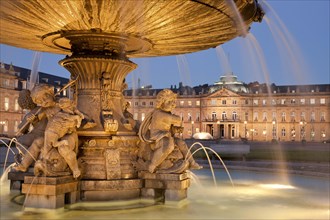 Fountain on Schlossplatz and New Palace at night