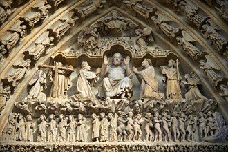 Tympanum of the central west portal showing Gothic sculptures of Christ in Majesty presiding over the Day of Judgement