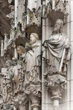 Holy sculptures at the Gothic entrance portal