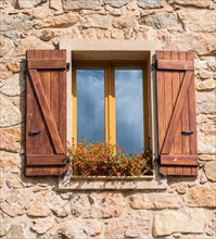 Windows with brown shutters