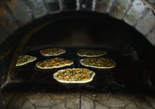 Pizza is baking in a kiln