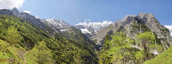 View from the Knappenhauser to the snowy peaks of the Alpspitze and Zugspitze and on the Hollental valley