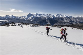 Ski touring the ascent to Cima Bocche on Passo Valles