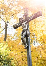 Crucifix with fall trees